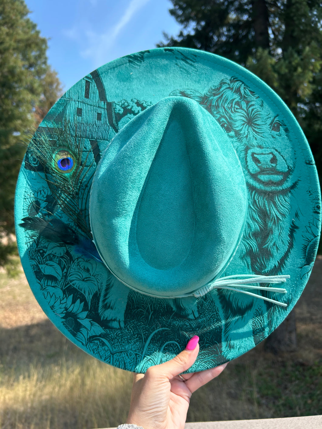Teal Highland Cow With Peacock Feather Engraved Fedora Hat