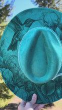 Load and play video in Gallery viewer, Turquoise Floral and Hummingbird Design Fedora Hat with Tassel Accent
